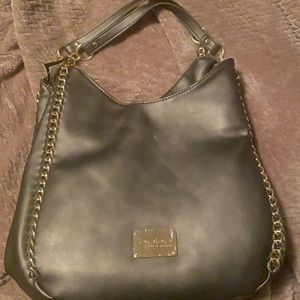 Brand new Bebe purse in color pewter